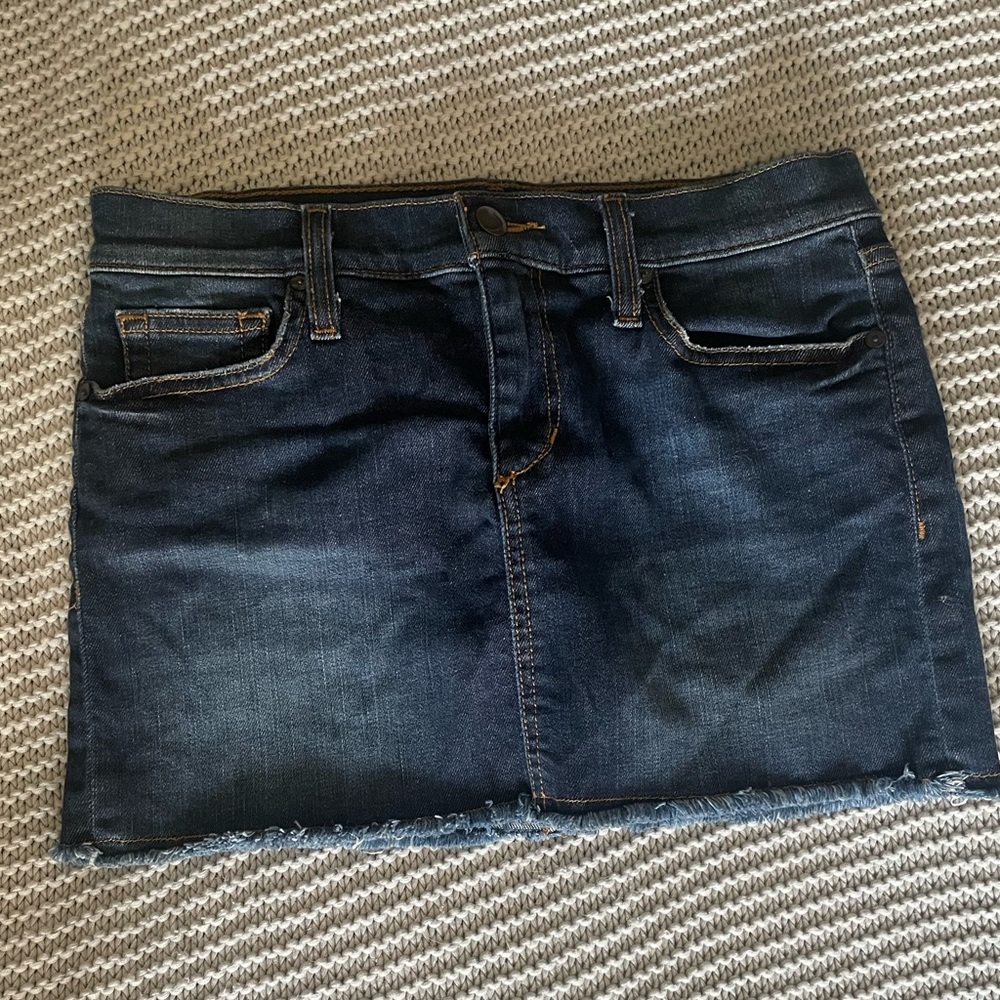 Mini denim skirt with frayed bottom